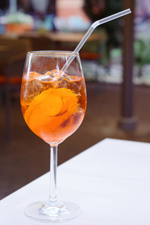 One glass of spritz aperol cocktail with orange slicesの写真素材