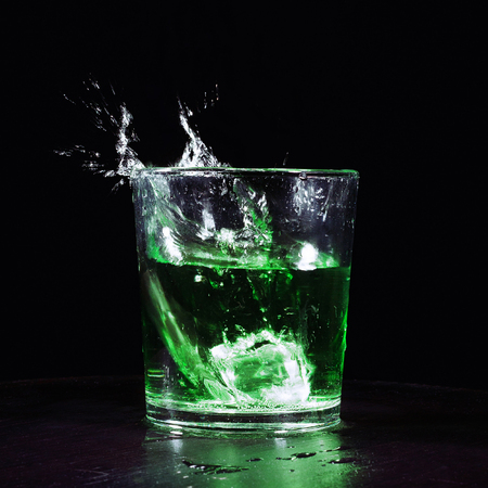 Green cocktail with splashの写真素材