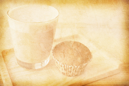 Vintage paper texture with a glass of cappuccino and a muffinの写真素材