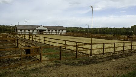 paddocks for horses and horse stables for building the farm