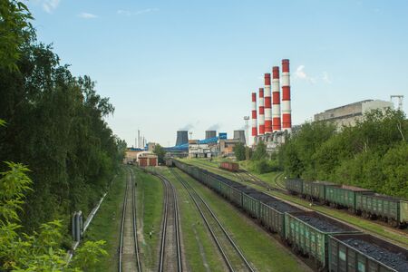 wagons loaded with coal on the railroad tracks are waiting for unloading in CHPの写真素材