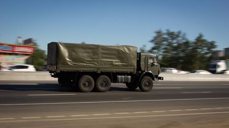 army truck driving on the roadの写真素材