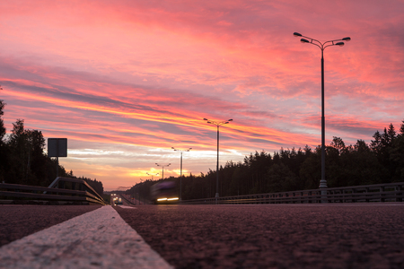 a highway at dawn. car motion blurの写真素材