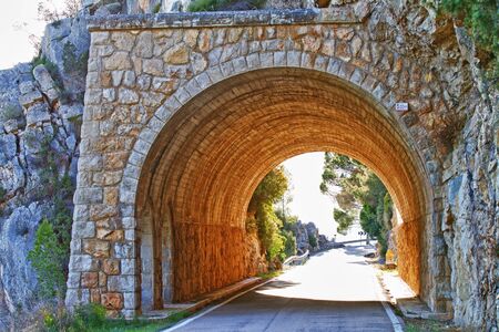 Stone tunnel at mountain roadの写真素材