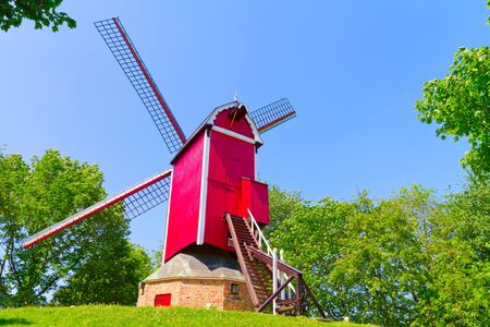 Windmill and green lawn at Bruggeの写真素材