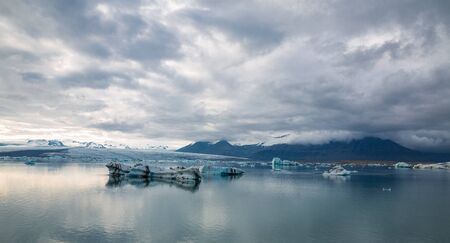 Wide angle view of blue icebergs floating in Jokulsarlon glacial lagoon, Icelandの写真素材