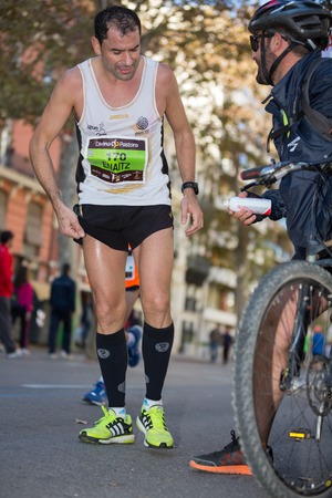 VALENCIA - NOVEMBER 17: Aitor Cabezas Garcia (number 170) runner participates in Valencias marathon on November 17, 2013 in Valencia, Spainのeditorial素材