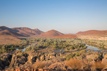 Wide view of Epupa waterfalls in summer time, the border of Angola and Namibiaの写真素材