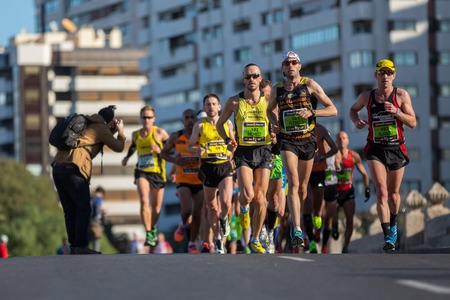 VALENCIA - NOVEMBER 17: Perdo J (number 161) leads his group durint his participation in Valencias marathon on November 17, 2013 in Valencia, Spainのeditorial素材
