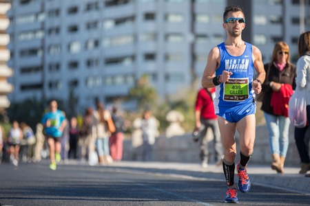 VALENCIA - NOVEMBER 17: Gilles Rubio  (number 439) participates in Valencias marathon on November 17, 2013 in Valencia, Spainのeditorial素材