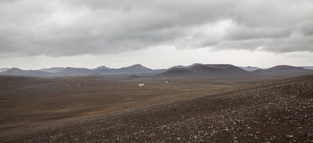 Barrenness of Landmannalaugar in Iceland with tourist carsの写真素材