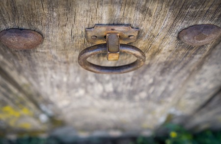 Top view of Old doorknocker and door