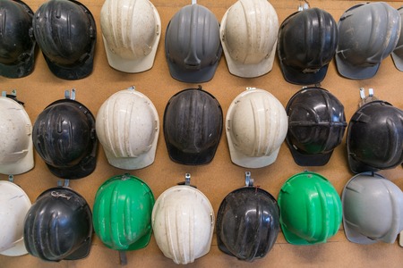 Protection helmets on wallの写真素材