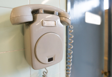 Old phone and office doorの写真素材