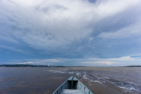 The Meeting of Waters in Manaus on boat, the confluence between the Rio Negro and Rio SolimÃµesの写真素材