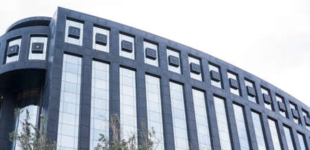 Detailed view of office bulding with long glass windows
