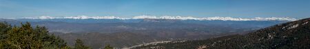 Top of Pyrenees mountais covered with snow, panoramic view