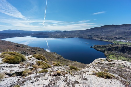 Ultra wide angle view of entire Sanabria lake in Spainの写真素材
