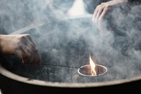 People light incense sticks for praying, Japanの写真素材