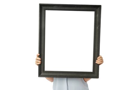 Front view of woman hands holding old vintage black empty frame, copy spaceの写真素材