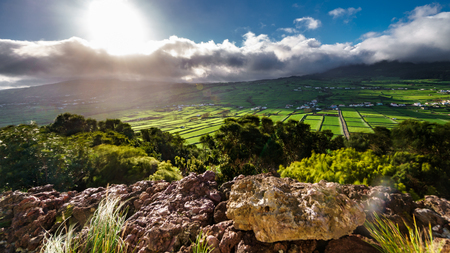 High contrast backlit of farm fields in the Terceira island, Azoresの写真素材