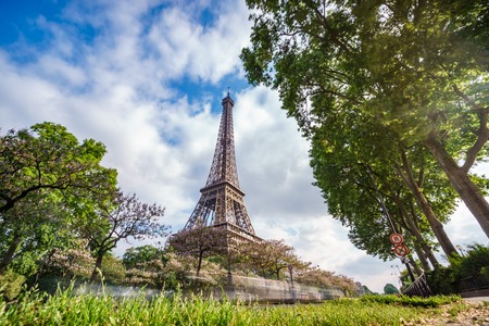 The Eiffel tower with car trails and cloudy skyの写真素材