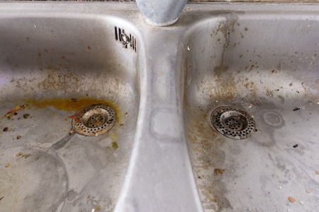 Really dirty stainless steel double kitchen sinkの写真素材