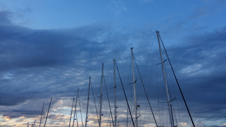 Sailboat mast against a cloudy Sky