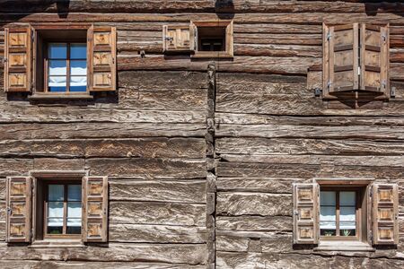 Wooden house and wooden window shuttersの写真素材