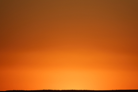 Beautiful sunset with orange sky. Sky Background.の写真素材