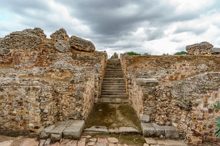 Old roman stone stairs and cloudy skyの写真素材