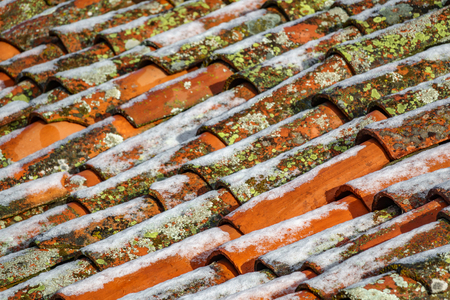 Tile roofs with iceの写真素材