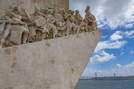 LISBON, PORTUGAL - APRIL 4, 2018: Monumento aos Descobrimentos with 25th april bridge in the background in Lisbon, Portugalのeditorial素材