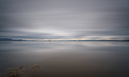 Ultra long exposure of rice field and cloudy skyの写真素材