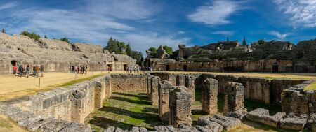 Italica amphitheater with touristsのeditorial素材