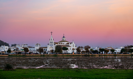 El Rocio village at dusk with pink skyの写真素材