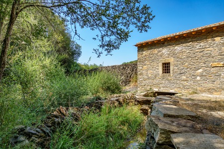 Detail of old watermill abandoned stream canalの写真素材