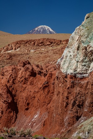 Licancabur volcano mountain peak over Rainbow valleyの写真素材