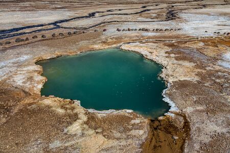 Hot spring with bright colors in the desertの写真素材