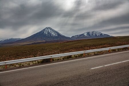 High slope road in Atacama with Licancaburの写真素材