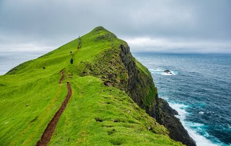 Narrow path toward the end of the islandの写真素材