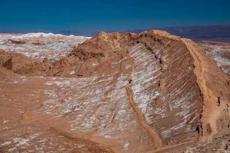 Moon valley with tourists in Atacama desertの写真素材