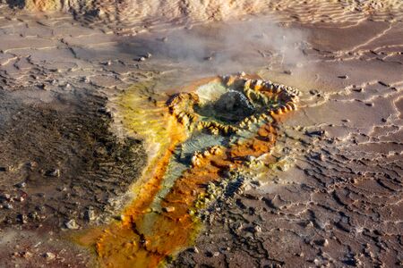 Hot spring with bright colors in the Tatio geysers of Atacamaの写真素材