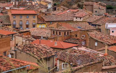 Detailed view of antique tile roofs and housesの写真素材