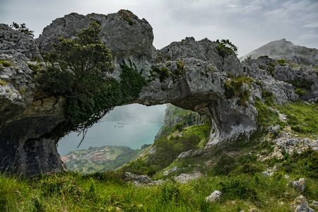 Devil eyes hole to the sea, Cantabria, Spainの写真素材