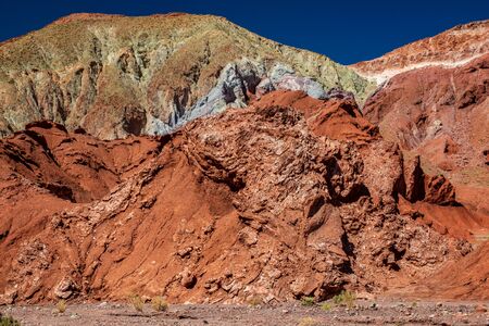 Red and green sand under blue skyの写真素材
