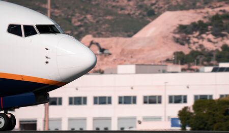 Jet plane snout landing in the runwayの写真素材