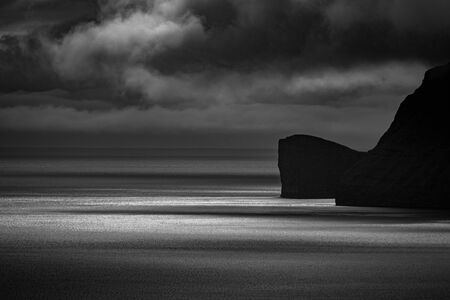 Sorvagsvatn lake vertical cliffs over the ocean, Faroe Islandsの写真素材