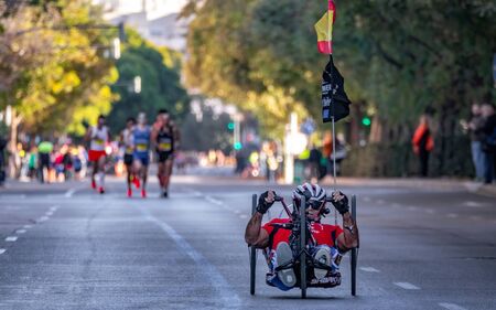 Unidentified man on wheelchar leads the raceのeditorial素材