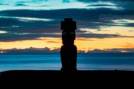 Sunset over Easter Island with Moai silhouette and silk waterの写真素材